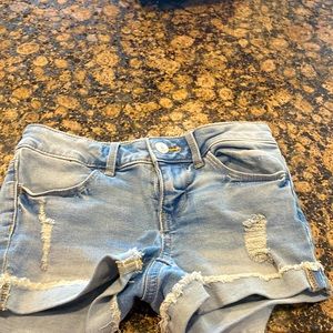 Light blue Jean shorts with a zip up and one button